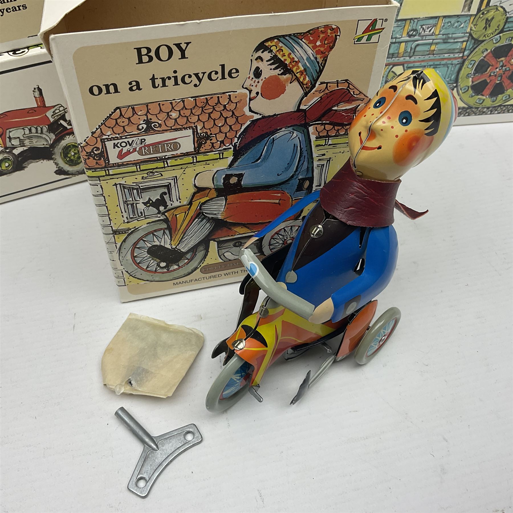 Kovap - eleven tinplate models to include Tractor and Trailer, Road Roller 1927, Moving Moneybox 1924, Hawkeye type B 1924, Boy on a Tricycle; all in original boxes 