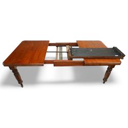 Late Victorian mahogany extending dining table with two leaves, moulded chamfered edge above, turned and reeded legs and ceramic castors, winding handle included, 205cm extended, 132cm closed, 102cm wide, 73cm high
