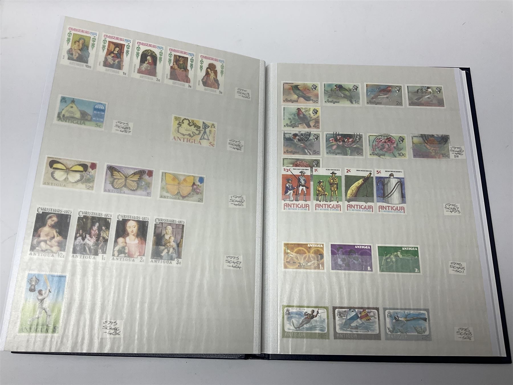 World stamps with many relating to Victory in Europe including King George VI '8th June 1946' stamps from various countries including Antigua, British Guiana, British Honduras, British Solomon Islands, Cayman Islands, Ceylon, Fiji, Grenada, Montserrat, St Helena etc, both mint and used stamps seen, housed in three stockbooks