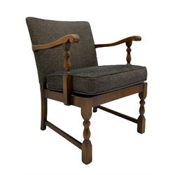 Mid to late 20th century medium oak framed open armchair, upholstered loose seat cushion and back in dotted fabric, on turned supports