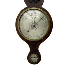 A mid Victorian mercury wheel barometer retailed by Thomas Grey of Newton Stewart, in a mahogany case with inlay to the edge, swans neck pediment and rounded base, with an 8” silvered register recording barometric air pressure from 28 to 31 inches with weather predictions, brass recording hand and steel indicating hand within a convex glass and cast brass bezel, silvered “butlers” mirror with reeded wooden surround and a round topped thermometer box with a mercury thermometer measuring degrees Fahrenheit, level bubble with silvered nameplate. H96cm
.


