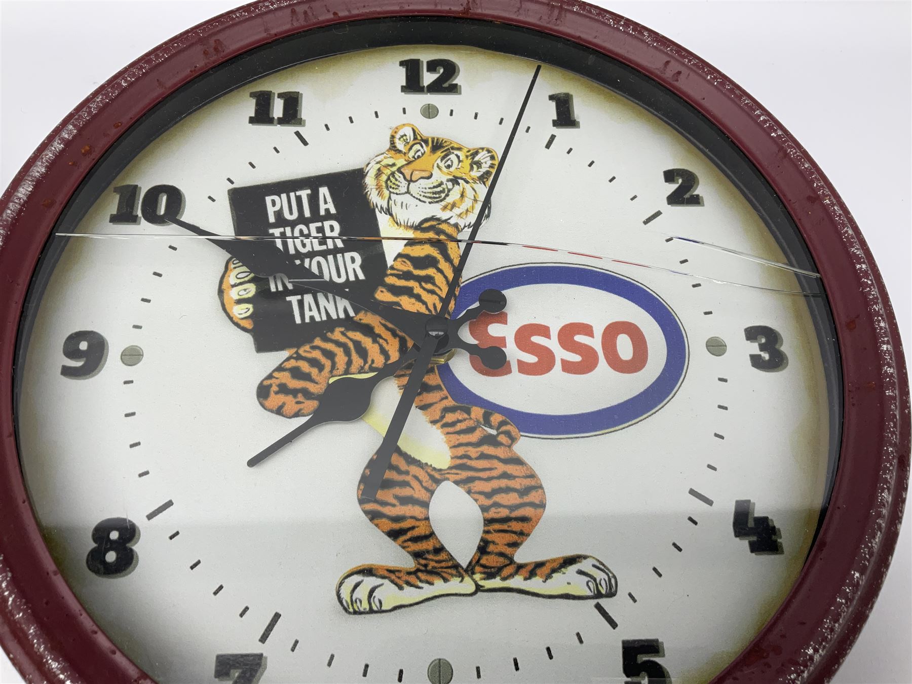 Esso Advertising Wall Clock, 'Put A Tiger In Your Tank', together with Jones & Co wall clock, largest example D40cm