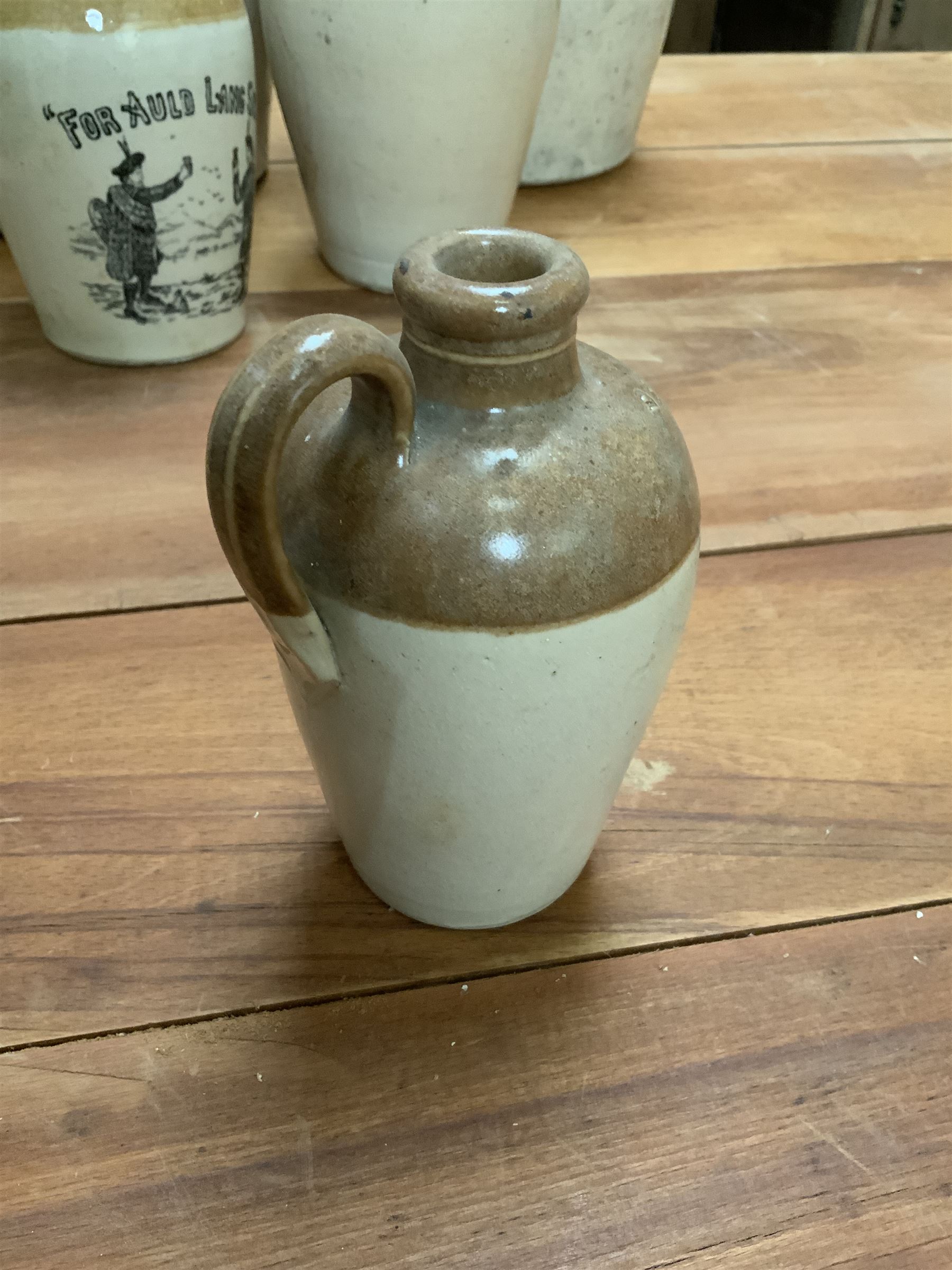 Group of 19th century Scottish stoneware alcohol flagons, including a pictorial 