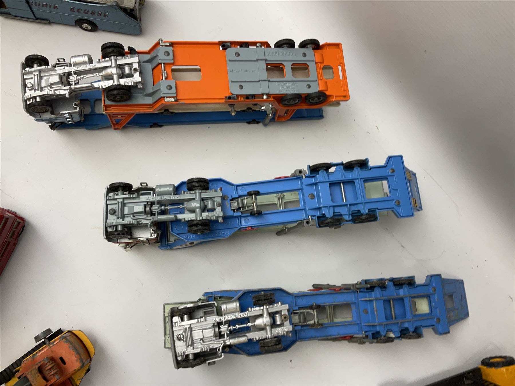 Corgi - eighteen unboxed and playworn/repainted die-cast commercial vehicles including Commer 5-Ton Wagon with drop-side trailer and two other 5-Ton wagons, Dodge Key Fargo, Jeep FC-150, two London Routemaster buses, Carrimore Trideck Transporter, two Carrimore Mark IV Transporters, Carrimore Low Loader, Ecurie Ecosse Racing Car Transporter etc (18)