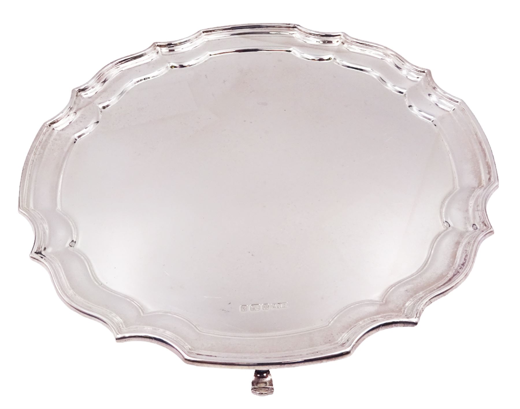 Modern silver salver, with shaped pie crust rim, upon four scroll feet, hallmarked L R Watson, Sheffield 1997, D21cm