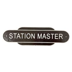 Cast iron Station Master wall plaque on a brown ground, L39cm