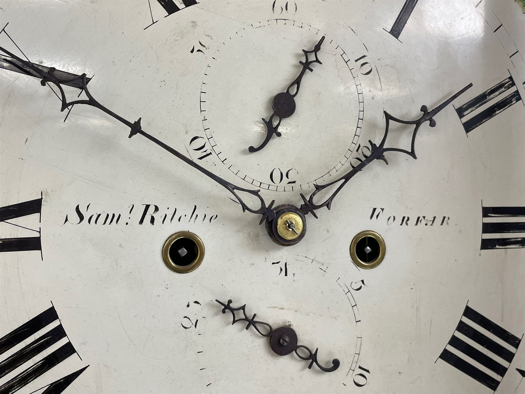 Samuel Ritchie of Forfar - William IV 8-day Scottish longcase clock in a mahogany case, with a swans neck pediment, brass paterae and three ball and spire brass finials, case and trunk inlaid with satinwood stringing on a plinth raised on decorative bracket feet, painted break arch dial depicting a costal scene to the break arch and conch seashells to the spandrels, Roman numerals, subsidiary seconds and date dials with matching steel hands, with a rack striking movement striking the hours on a bell. With weights, key, and pendulum.  Samuel Ritchie is recorded as working in Forfar 1800-37.