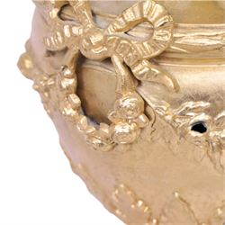 Pair of Rococo style gilt metal table lamps, the urn shaped bodies each with applied figure seated upon shoulder, and female mask to opposite side issuing scroll leading to top of neck, the body cast and applied with stiff leaf detail, and foliate swags and wreaths, upon square pink marble plinths with applied gilt metal mask mounts, and four gilt metal bracket feet, each supported a pleated cream silk closed top lampshade, H63cm