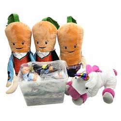 Three large ALDI Kevin carrots and giant unicorn stuffed toy together with quantity of smaller carrots