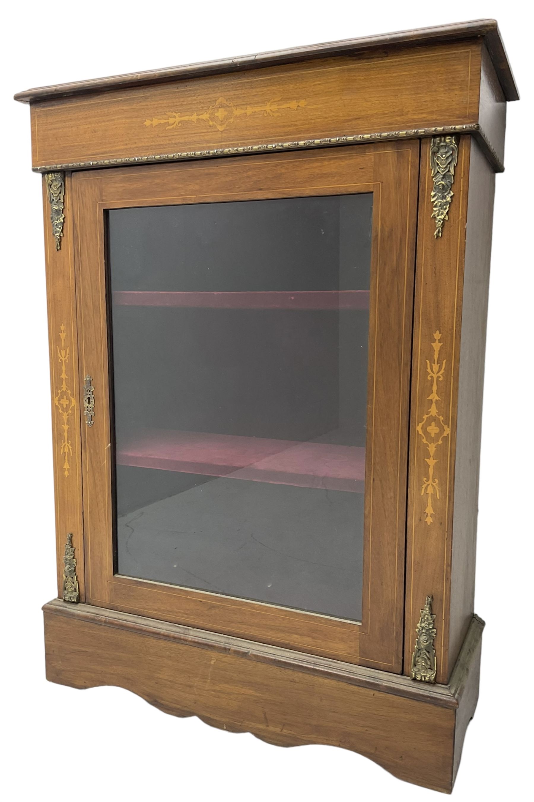Victorian walnut pier cabinet, moulded rectangular top over inlaid frieze, decorated with gilt metal mounts and beading, the glazed single door flanked by inlaid uprights, on moulded plinth base