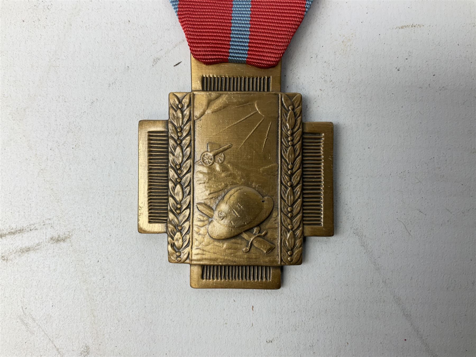 Five continental medals - WW1 Belgian Cross of Fire; WW1 French Croix De Guerre; French Croix De Combattant; French Republic Workers silver merit awarded to L. Mounet 1950; and boxed French Palmes Universitaires Officier d'Academie silver and enamel wreath (5)