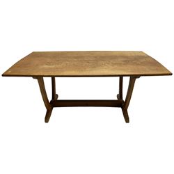 Acornman - oak dining table, shaped rectangular adzed top, wishbone end supports on sledge feet joined by stretcher, by Alan Grainger, Brandsby, York