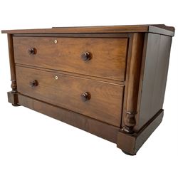 Victorian mahogany chest, raised back, fitted with two deep drawers with bone escutcheons, flanked by half-canted inset pilasters, on compressed bun feet