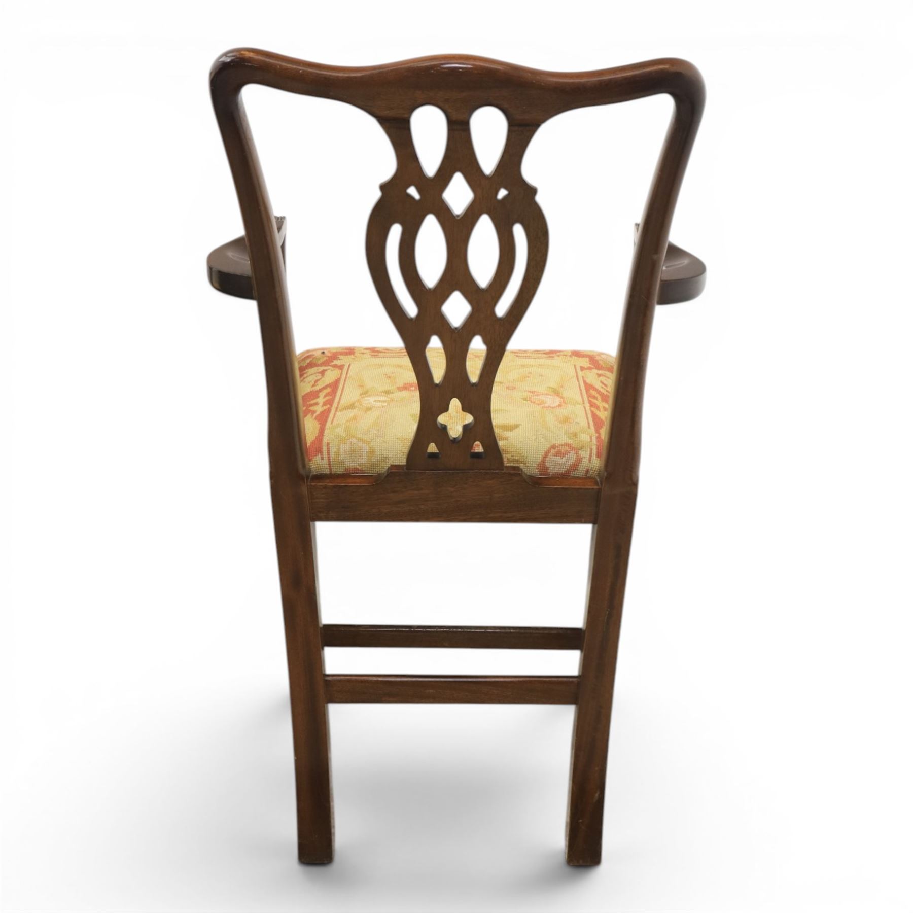 Large 19th century mahogany extending dining table with set of Chippendale design chairs, extending dining table with rectangular moulded top additional three leaves, raised on turned supports terminating in brass castors, the dining chairs (2 + 2) with shaped cresting rail and pierced splats, raised on square supports with stretchers
