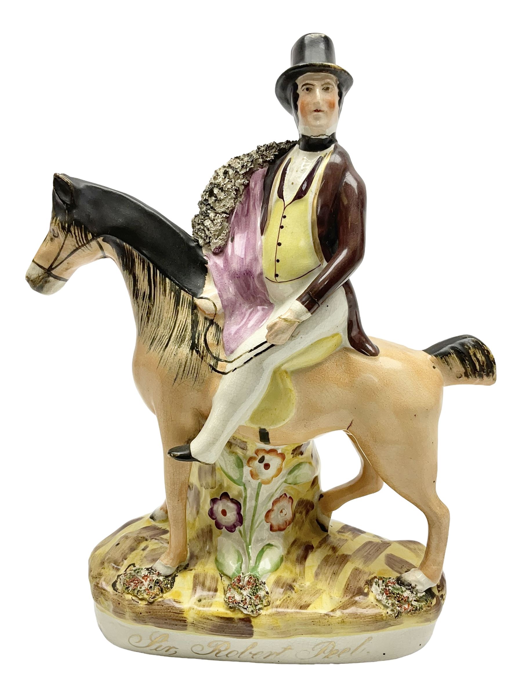 19th century Staffordshire figure of Robert Peel, titled 'Sir Robert Peel', modelled on horseback, atop an oval plinth base featuring a naturalistic and floral design, H30cm 