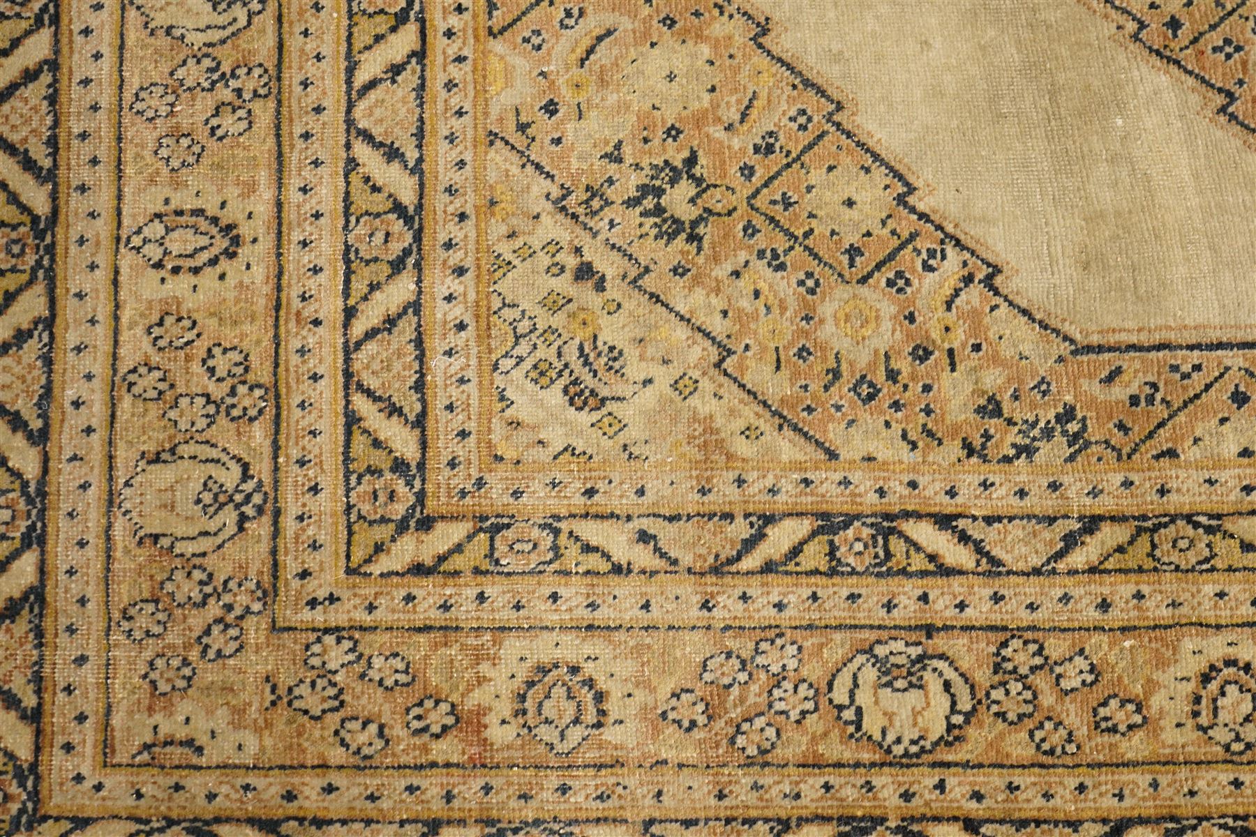 Two hand-knotted rugs, comprising Persian medallion rug and tribal rug, Persian hand-knotted rug, ivory ground centred by shaped floral medallion with pendants, surrounded by stylised flowerheads and foliate motifs, enclosed by multiple floral and geometric borders, H155cm, W123cm; tribal hand-knotted rug, dark brown ground with repeating linked geometric diamond medallions in orange and green, enclosed by ivory geometric border, striped ends with fringes, H150cm, W71cm