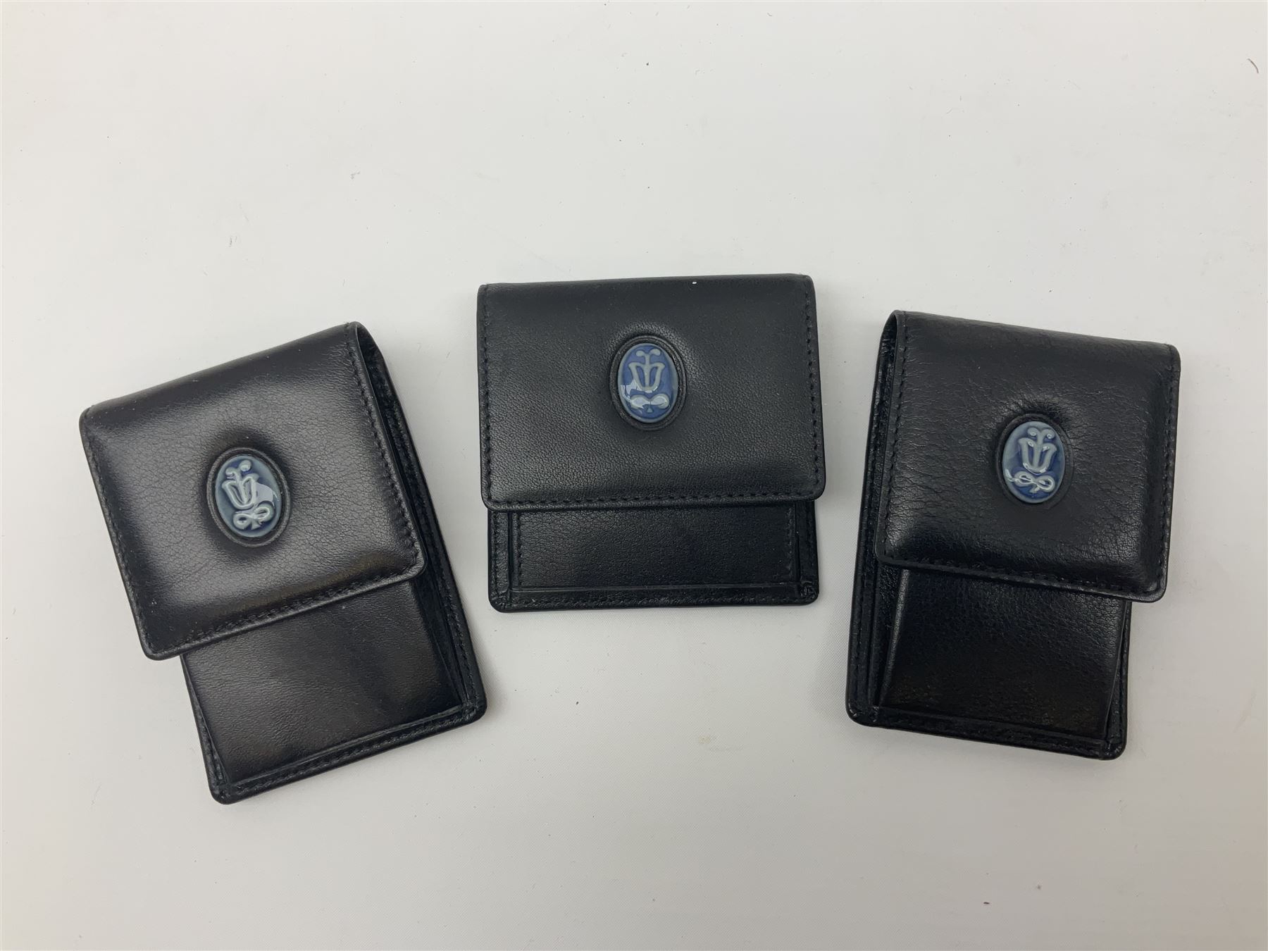 Lladro Collectors Society items, comprising of The Will to Create book, two candle holders; Sailing the Sea no 17665, Dolphins at Play no 17666, Plaque Bringing Us Together, key fob, leather wallet and a members joining pack with plaque, all in original boxes  