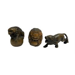 Three netsuke, modelled as two mythical creatures and a lion