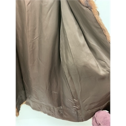 A lined Musquash fur coat. 