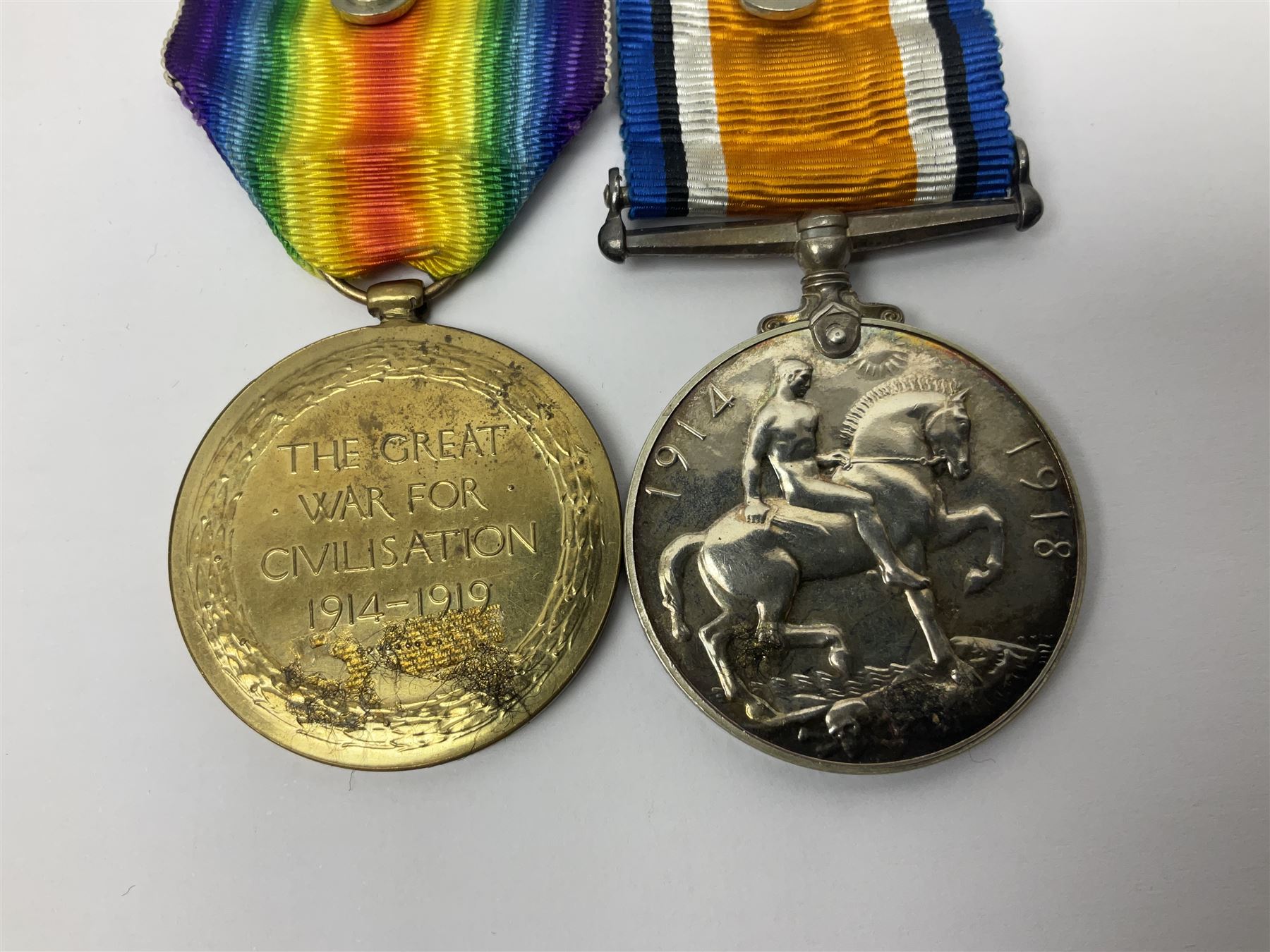 WWI pair of medals comprising British War Medal and Victory Medal awarded to G/62196 Pte. H. Ferguson R. Fus. with ribbons on wearing bar; together with bronze memorial plaque to Henry Ferguson (3)