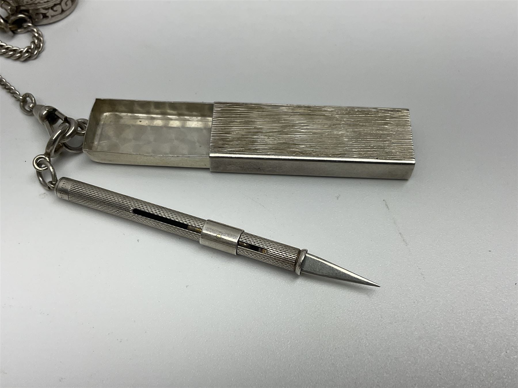 Victorian style silver chatelaine necklace, suspending eight silver sewing and similar accessories, including tape measure, needle case, pencil holder, powder compact and pill box