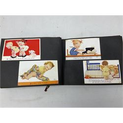 Fine and large collection of approximately one-hundred and seventy Mabel Lucie Attwell postcards; some loose but predominantly loose mounted in two photograph albums