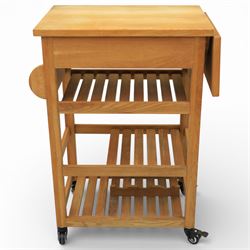 Modern oak butchers block, drop leaf end with towel rail to the other side, above three tiers raised on plastic castors 