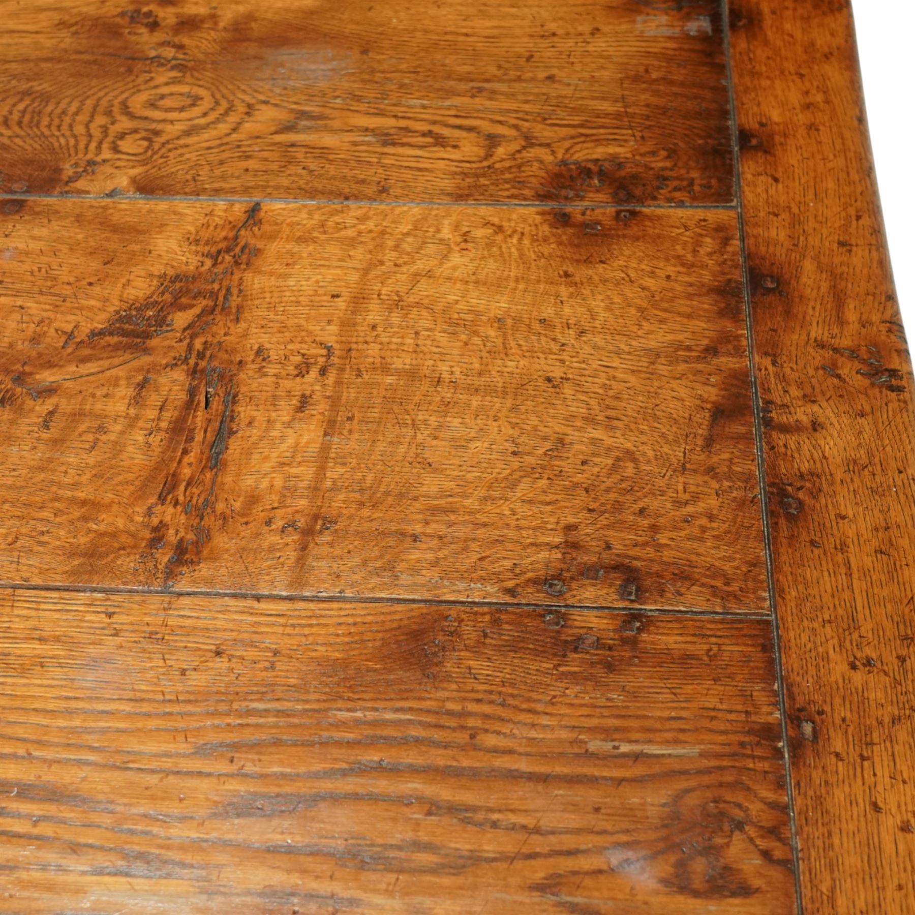 17th century design rustic oak refectory dining table, rectangular plank top over plain frieze rails, raised on heavily turned legs united by an H-stretcher  
