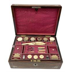 19th century mahogany sewing box with inlaid foliate mother of pearl decoration to exterior, the hinged cover opening to reveal a red watered silk lined and compartmented interior, the upper lift out tray containing a selection of bone, ivory and other accessories, H10.5cm L28cm D20.5cm