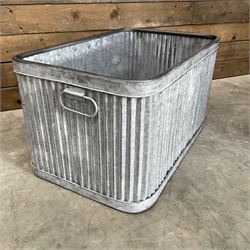 Set of three pressed metal planters in different sizes