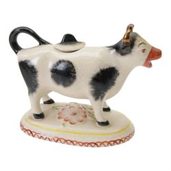 Collection of 19th century and later cow creamers, including three black glaze examples, two mottled brown examples etc  