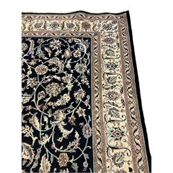 Central Persian part silk indigo ground Nain carpet, the field decorated with interlacing leafy branches and stylised plant motifs, scrolling design border within guard stripes 
