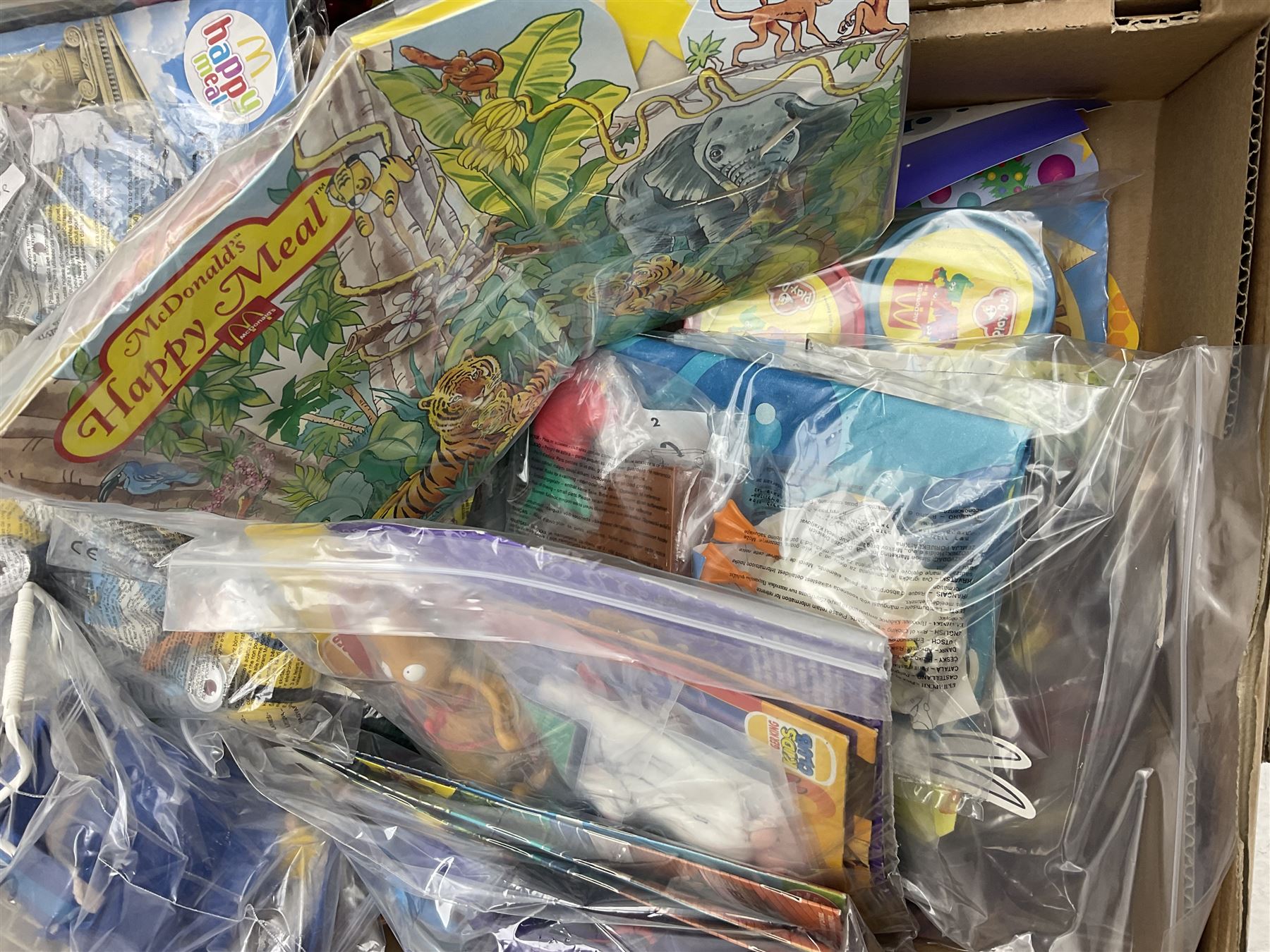 Large quantity of Mcdonalds toys to include Matchbox in four boxes