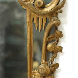 George III Chippendale design carved giltwood and gesso wall mirror, the impressive protruding pierced pediment decorated with flared acanthus leaves interspersed with flower heads and berries, over an arched outer-frame - the cresting comprised of C-scrolls carved with dripping icicle motifs, the uprights formed of scrolling acanthus with swags of grapevines and foliage, over a scrolled cartouche terminal, the inner-frame of architectural form with bell-flower details and a shaped cresting with scrolling acanthus leaves, all enclosing a central slightly bevelled rectangular mercury glass plate, surrounded by smaller plates