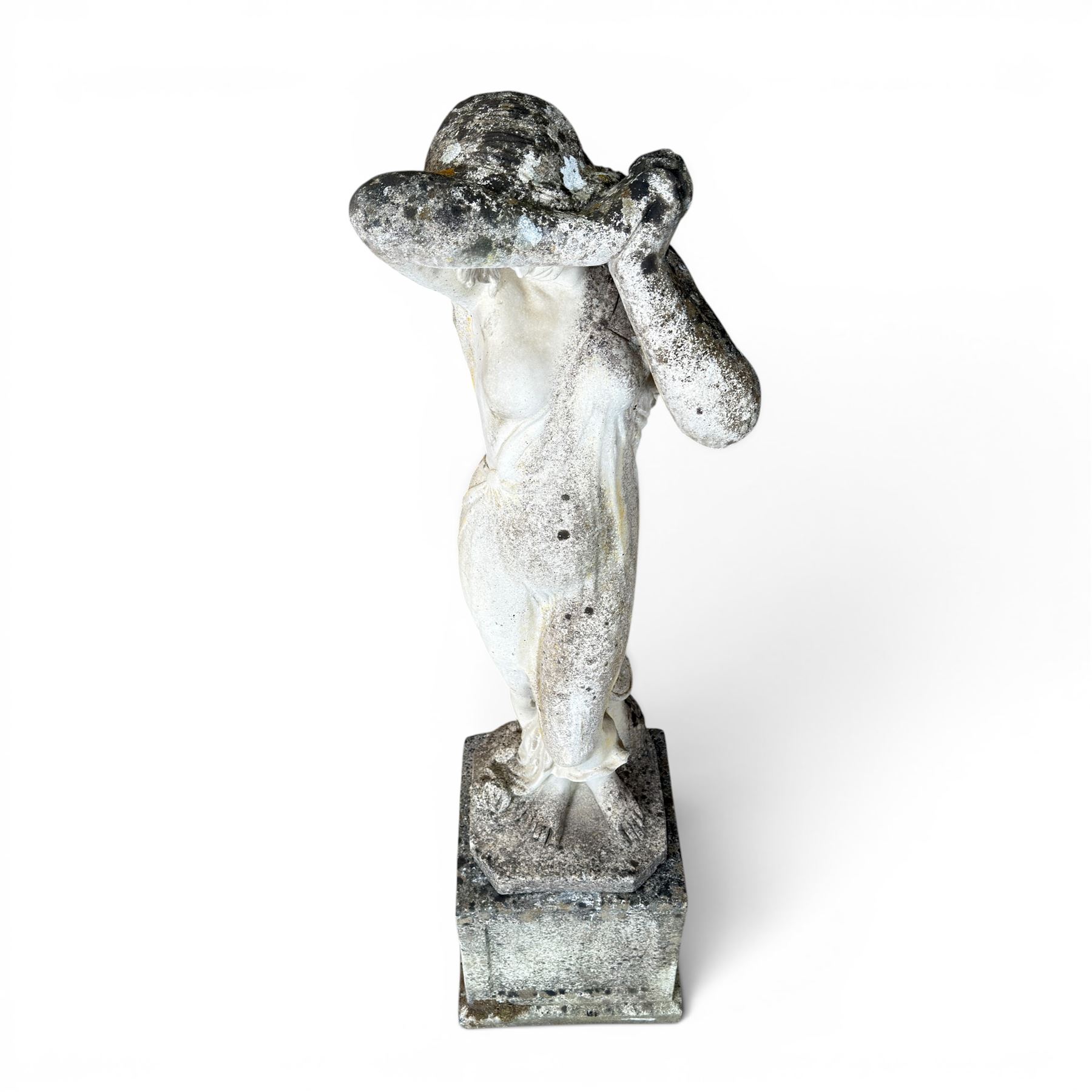 Weathered cast stone garden statue of a 'Shy Maiden', raised on square plinth base