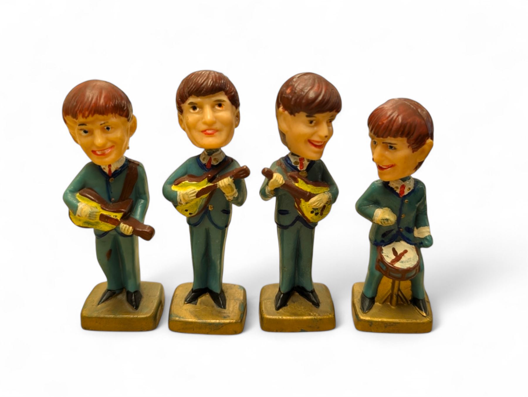 Set of four The Beatles plastic nodding bobble head figures