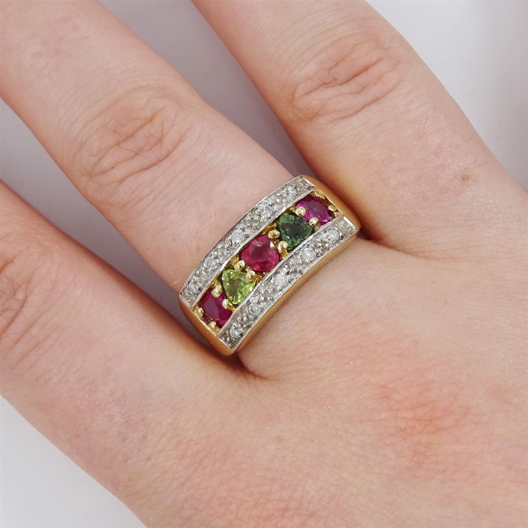 9ct gold trilliant cut pink and green sapphire half eternity ring, with diamond chips set either side, hallmarked