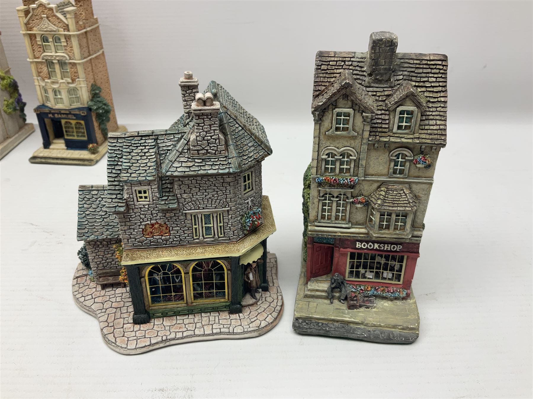 Thirteen Lilliput Lanes from the Shops Collection, including Apothecary, Horologist, China Shop, Penny Sweets, H Samuel etc, all with deeds and original boxes 