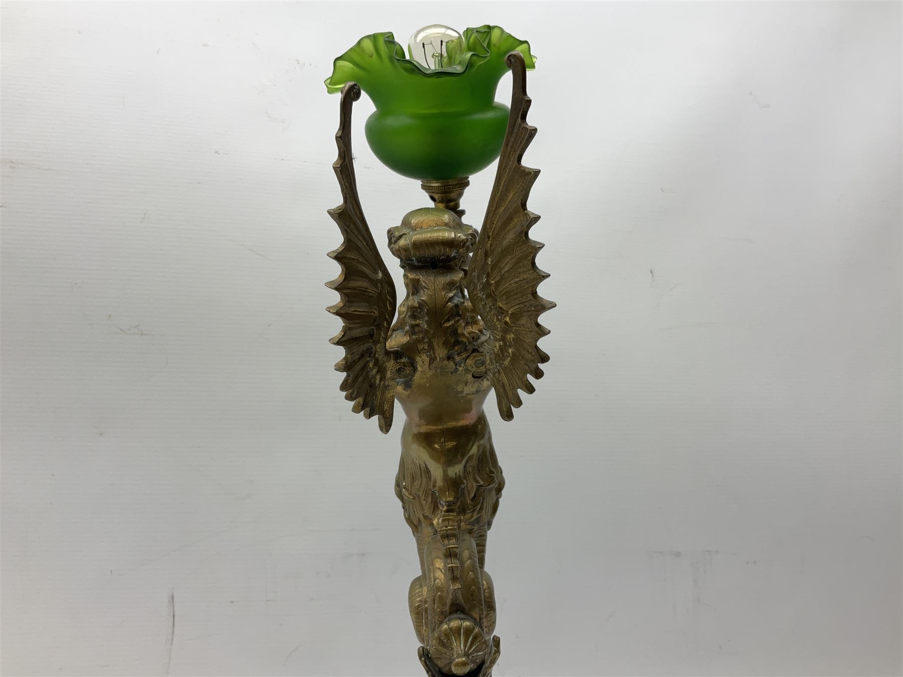 Victorian gilt bronze converted gas lamp in the form of  mythical winged mermaid upon a circular oak base, with a frilled green glass shade, H44cm