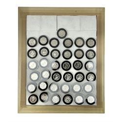 Thirty-seven commemorative fifty pence coins, including 2011 wrestling, other Olympics, Beatrix Potter etc, housed in capsules