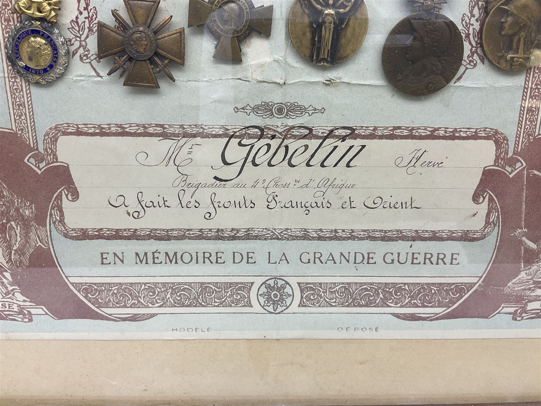 Six WW1 French medals comprising Valor Discipline 1870 3rd Republic Military Medal, Croix De Guerre with star, Croix Du Combattant, Medaille Inter-Alliee De La Victorie, Orient Medal and Medaille Commemorative De La Grande Guerre 1914-18; all with ribbons; mounted, framed and glazed with certificate named to Mr. Gebelin Herve Brigadier au 4th Chassrs. D'Afrique