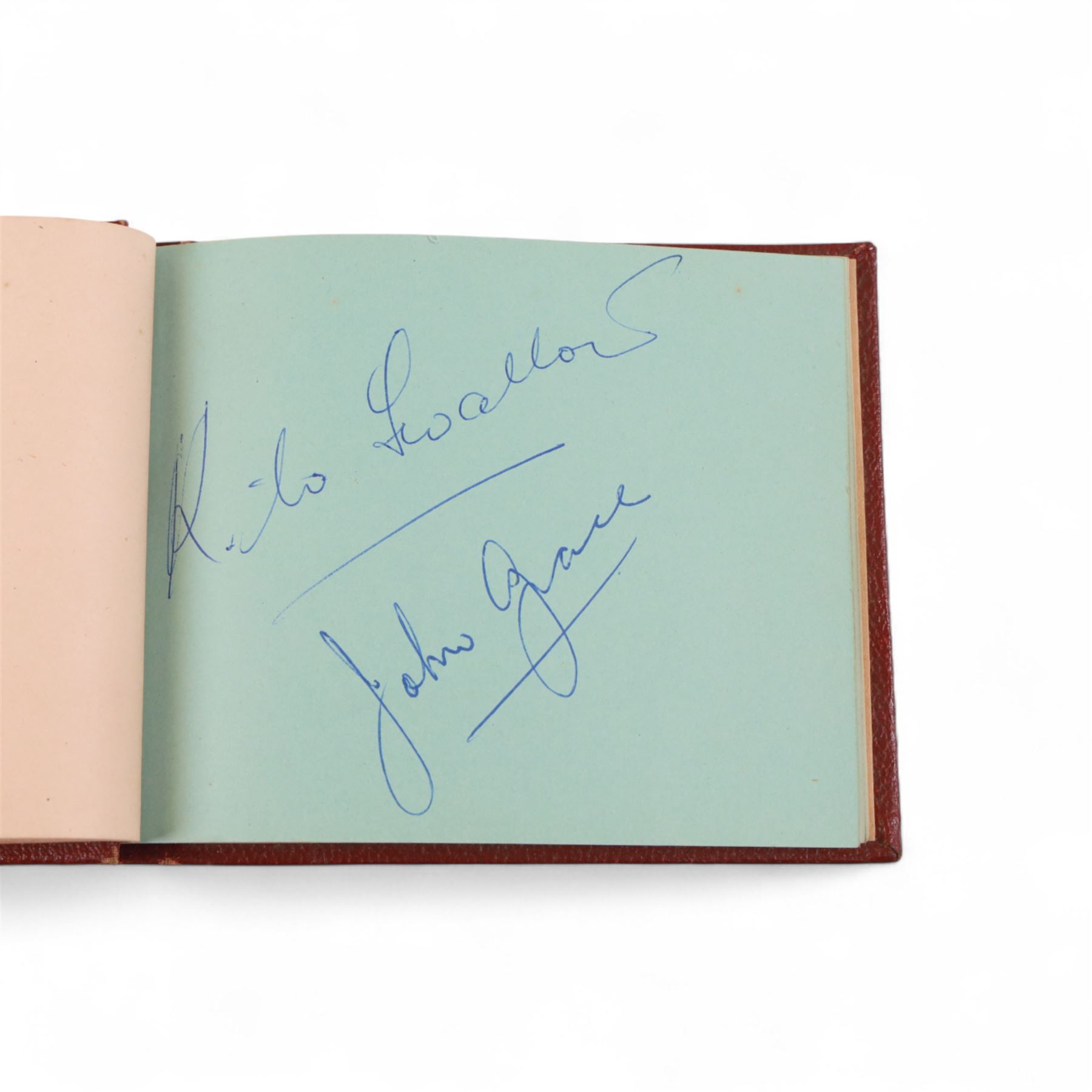1950s autograph book, containing mostly motorcycle racing signatures, including four-time World Sidecar Champion Eric Oliver, 1952 Sidecar World Champion Cyril Smith and1955 Junior TT Champion Jack Bailey, in red leather case with gilt lettering 