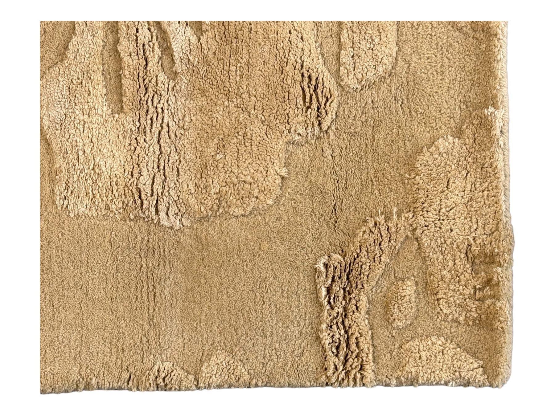 Laura Ashley - India made Claverton ground rug, monochromic taupe ground with relief floral motifs in a soft cream shade