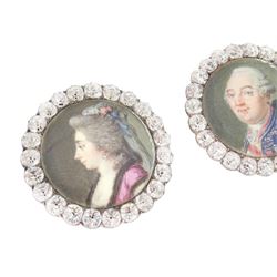 Set of six late 18th century French portrait miniature buttons, each finely painted upon ivory with a likeness of notable figures of the French Royal Court, set under glazed panels within silver frames mounted with paste stones, engraved verso with the sitters’ names and fitted with eyelets, later adapted with suspension rings; comprising “LE ROY” (Louis XVI), “LA REINE” (Marie Antoinette, youth portrait), “LA REINE” (Marie Antoinette, mature portrait), “MADAME” (Maria Josepha of Savoy, 1771–1810, wife of Louis, Comte de Provence, later King Louis XVIII), “M. BAILLY” (Jean Sylvain Bailly, 1736–1793, Mayor of Paris), and “M. L’ABBÉ MAURY” (Jean-Siffrein Maury, 1746–1817, Cardinal and Archbishop of Paris), overall D3.5cm. This lot has been registered for sale under Section 10 of the APHA Ivory Act