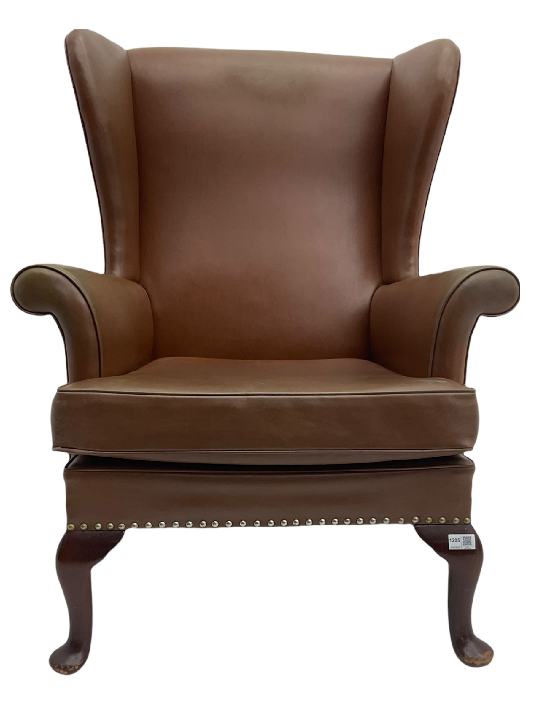 Parker Knoll mid20th century wing back armchair, upholstered in Rexine type cover The