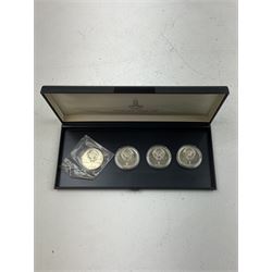 Russian 1980 Moscow Olympic Games silver twenty eight coin set, housed in dated red case and four other coins relating to the Olympics, housed in dated black case