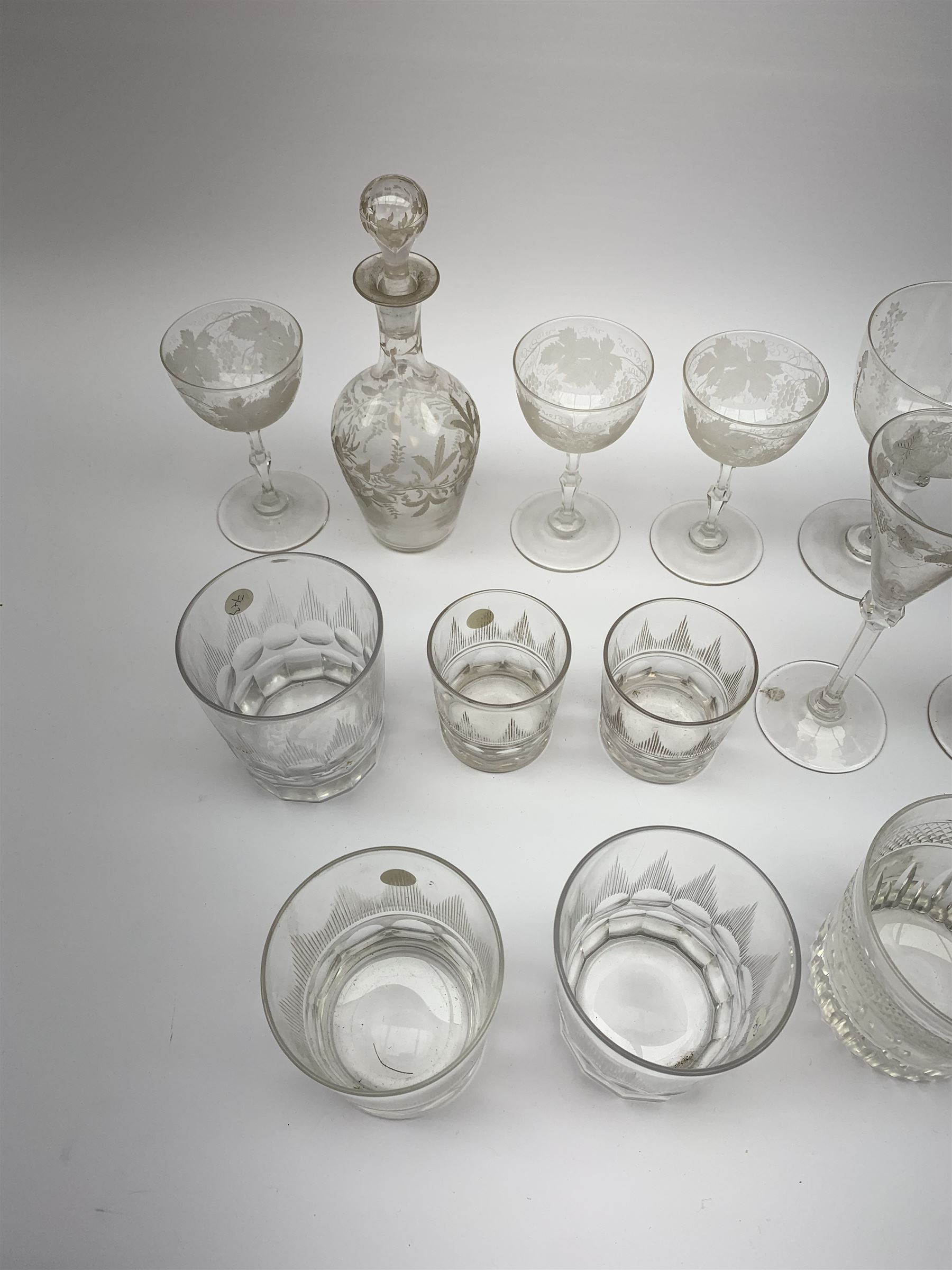 A number of Victorian tumblers and Edwardian drinking glasses, together with a large quantity of other later glassware, to include a glass table lamp base, drinking glasses of various forms, a number with cut decoration, other assorted cut glass including jug, vases, jars and covers, etc. 
