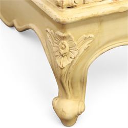 French Louis XV design cream painted double armoire, serpentine moulded pediment surmounted by carved foliate crest, enclosed by two shaped panel doors with applied scroll and leaf mouldings, enclosing a hanging rail and adjustable shelving, fluted uprights with carved floral terminals, on shaped apron and cabriole feet
