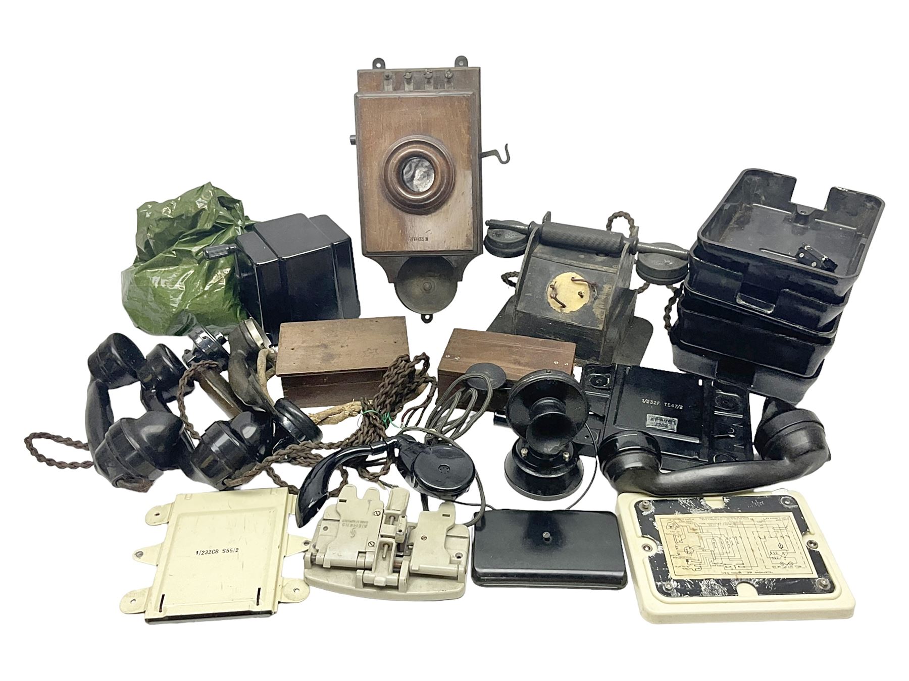 Collection of phone headsets, including GPO bakelite examples, together with other telephone parts 