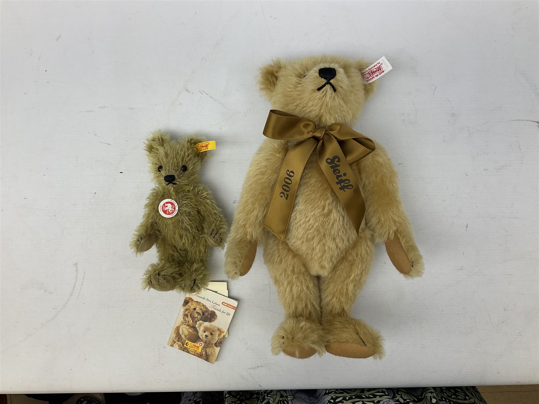 Two Steiff teddy bears comprising 2006 'Bear of the Year', limited edition with original dust bag and certificate, and 'Big Foot Bear' serial no. 002939, both with tags in ear
